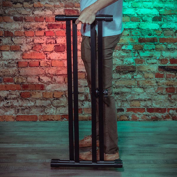 keyboard stand shown with man holding it