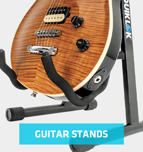 guitar stand holding electric guitar